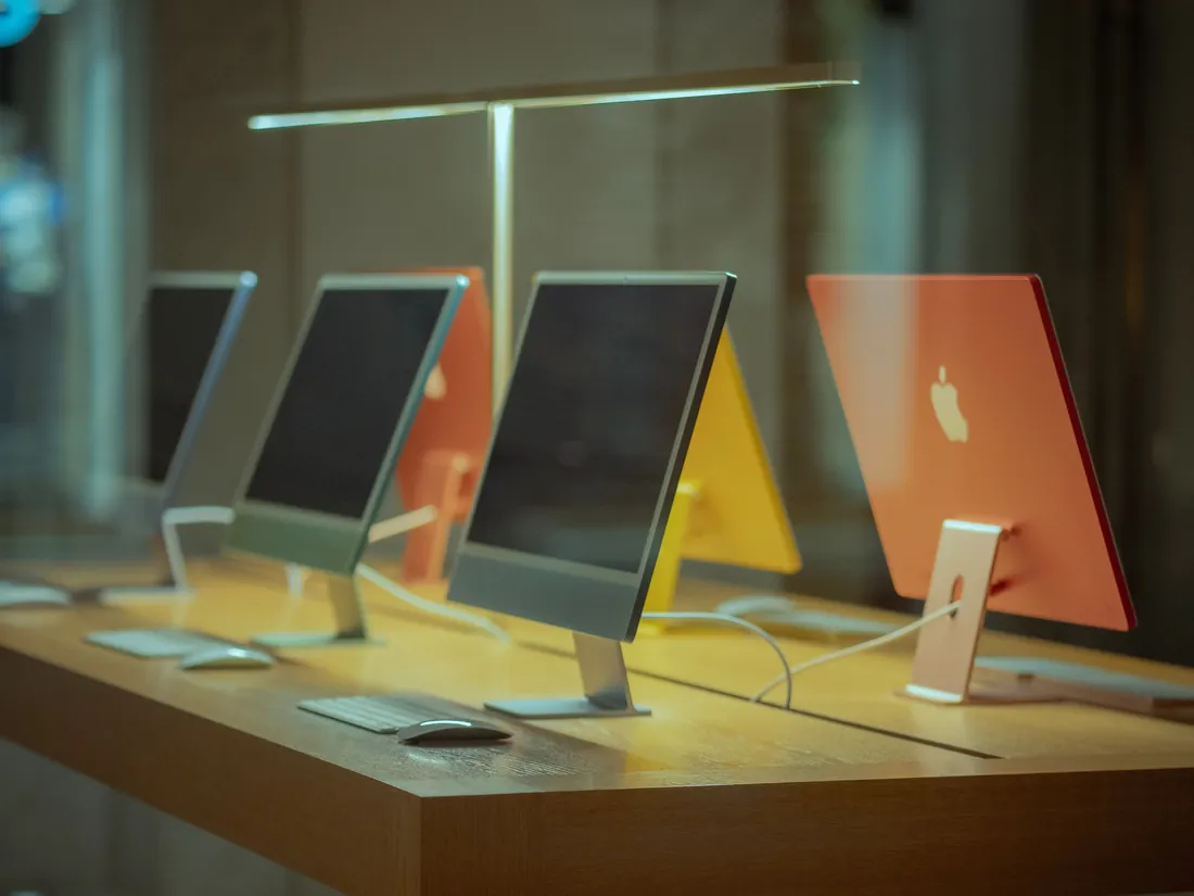 A row of iMacs set up side by side
